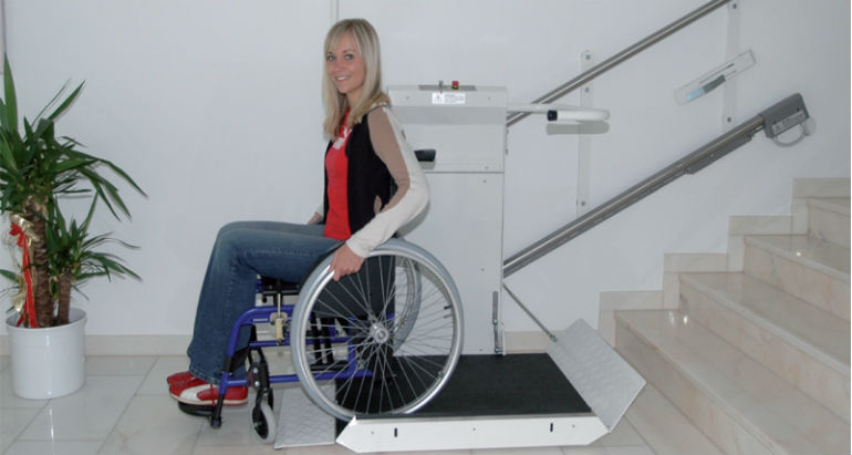 Commercial Wheelchair Lift near Syracuse ny image of woman in commercial wheelchair lift