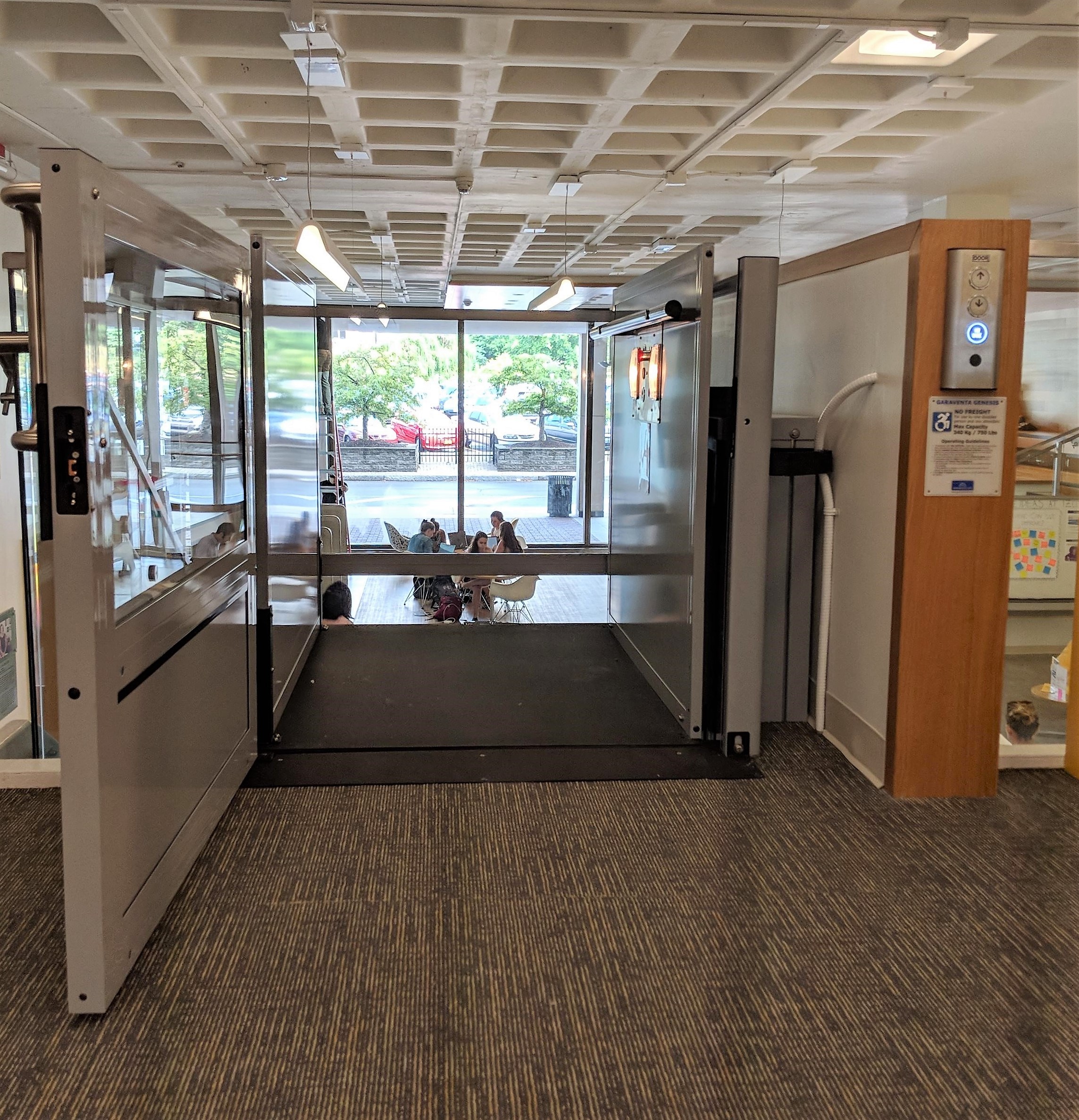 commercial ada lifts University Of Rochester Library Platform Looking Down With People