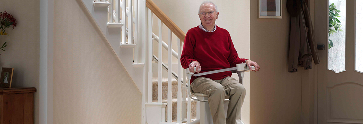 Home Accessibility Improvements Near Syracuse Ny Image Of Elderly Man Sitting On Stair Lift