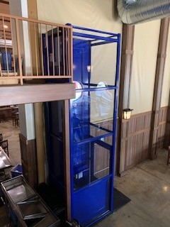Elevator Companies Near Syracuse NY Full View Top Image of Blue Wheelchair Lift