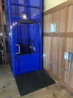 elevator companies near syracuse ny close up side view image of blue wheelchair lift