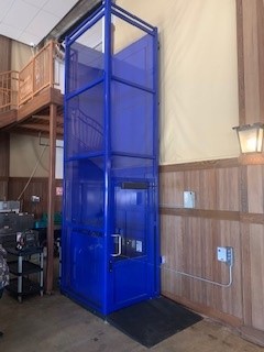 elevator companies near syracuse ny side view image of blue wheelchair lift