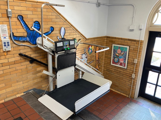 Syracuse-NY-Commercial-Wheelchair-Lift-Garaventa-from-Syracuse-Elevator-front-image-of-white-and-black-school-platform-lift
