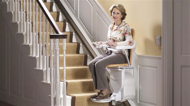 Stair Lifts Near Syracuse Ny Image Of Woman Using Stairway Lift At Home From Syracuse Elevator Company