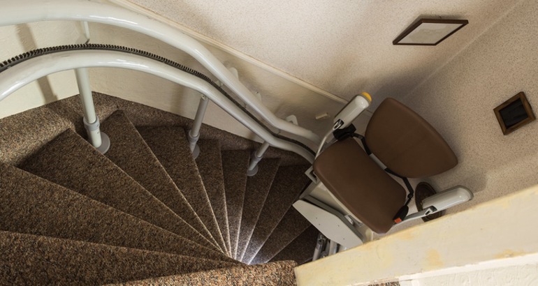 Chair lift Syracuse NY curved staircase Syracuse Elevator Company